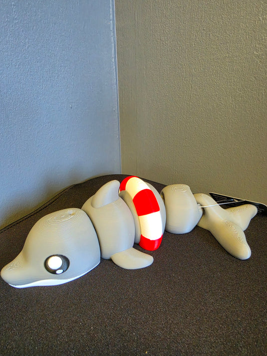 Articulated grey dolphin toy with a red and white life ring by FAN3DP