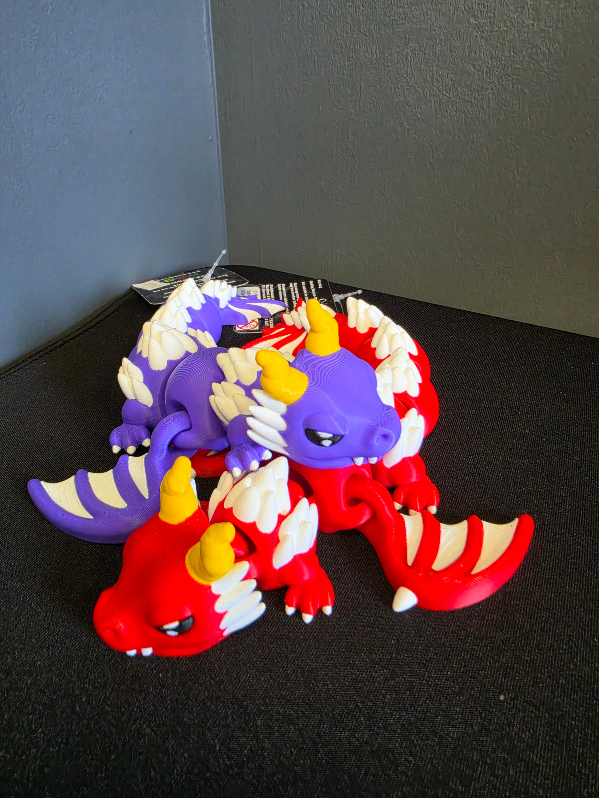 Red and purple Articulated Retro Dragon toys designed and printed by FAN3DP